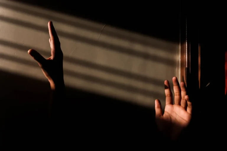 Hands in dramatic light