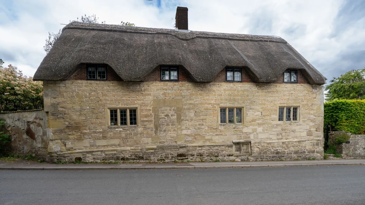An old thatched-roof cottage