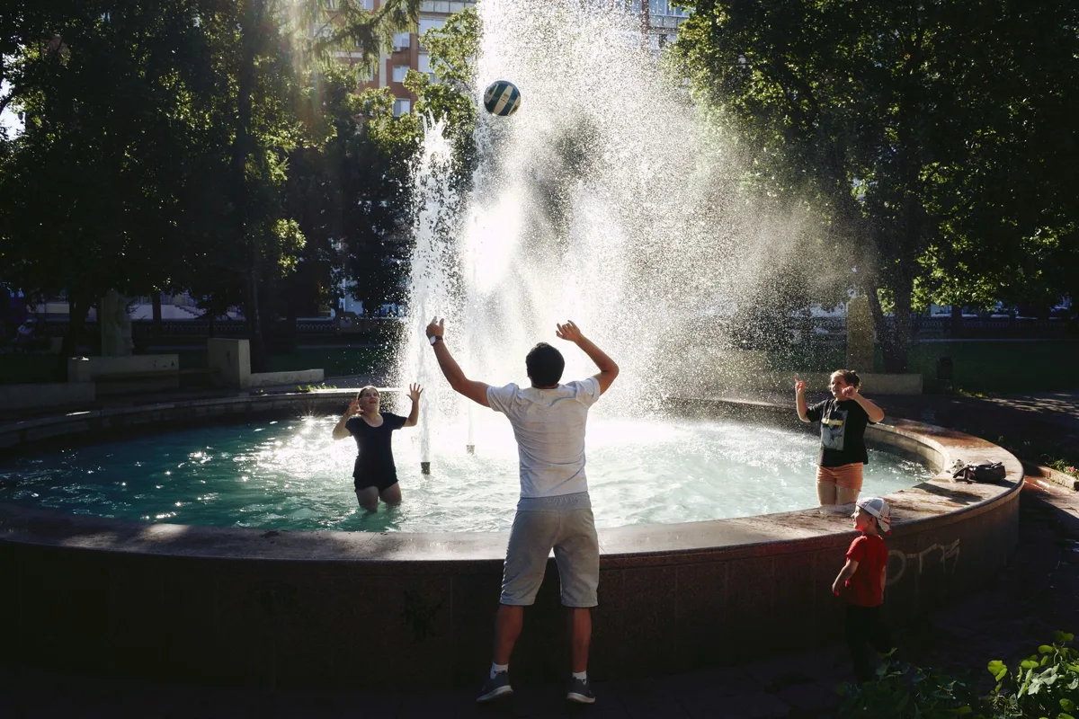 A golden ball by a fountain