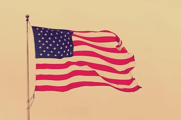 A large American flag on a pole